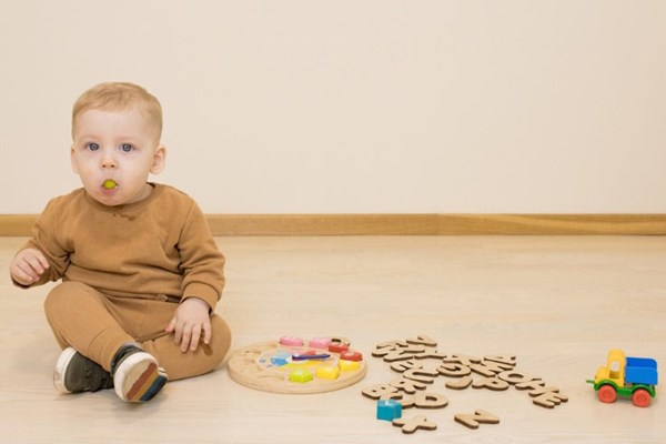 Little boy choking on a grape